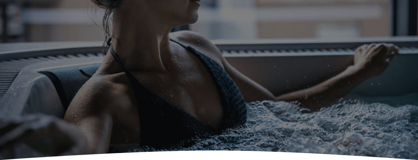 A young woman is relaxing in a jacuzzi