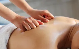 woman having back and shoulder massage